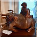 D18. Carved rosewood water buffalo with rider. 